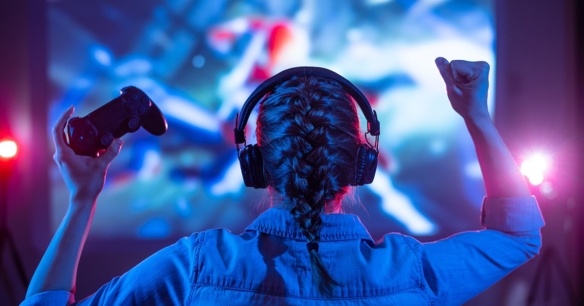 Young woman with braid celebrating a gaming win